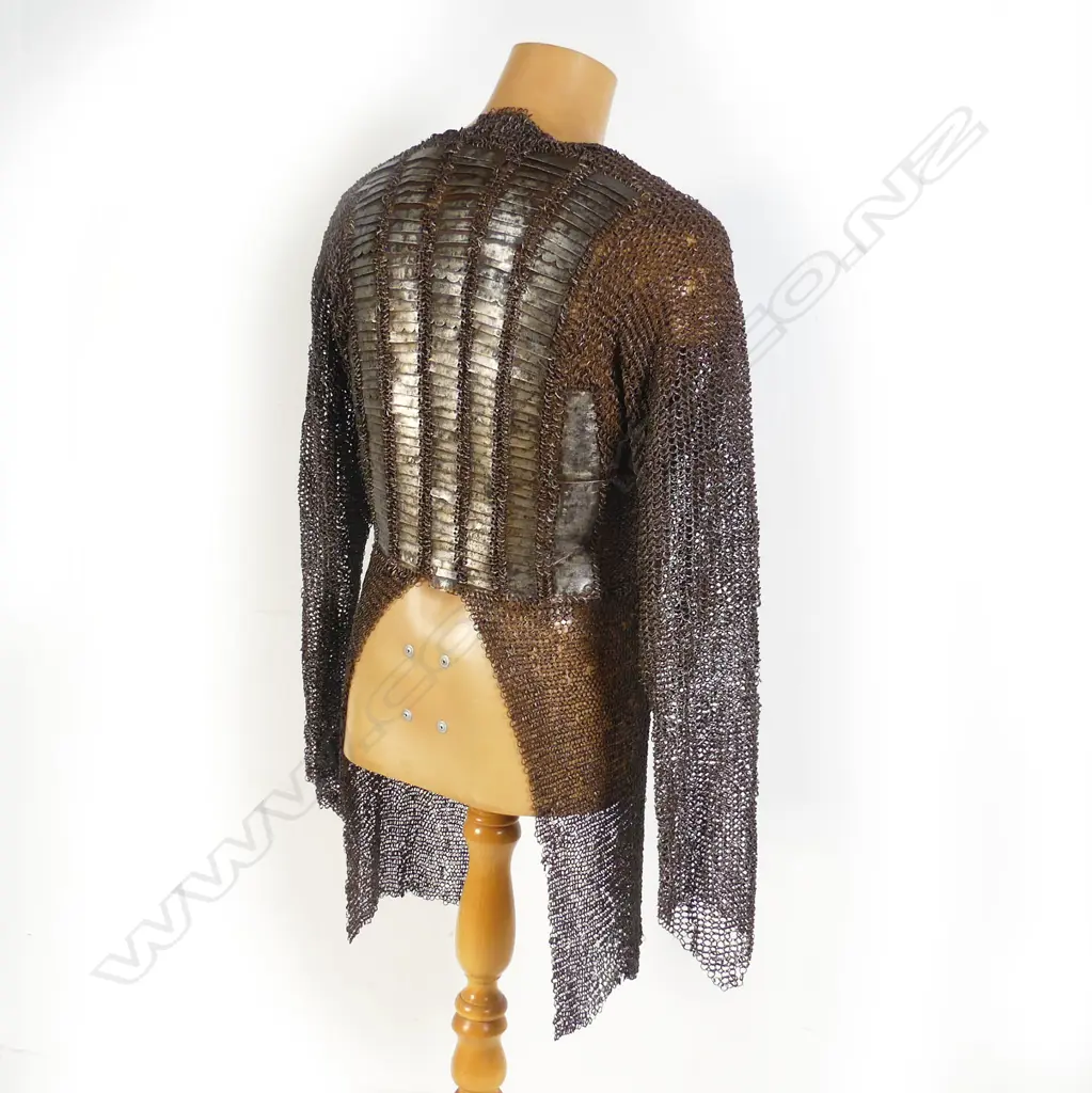 A 17thC Indian mail shirt and head covering with plume. Image 1++