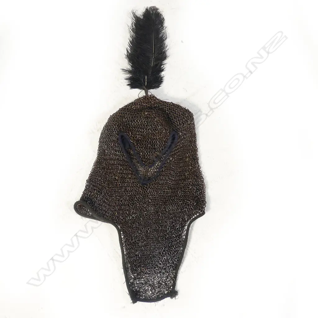 A 17thC Indian mail shirt and head covering with plume. Image 1++