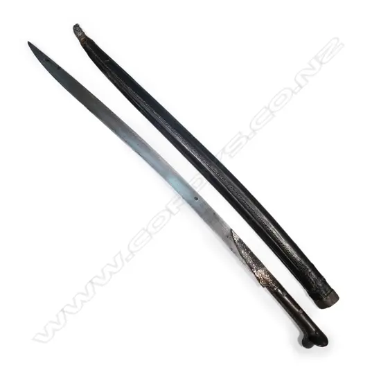 A 19thC Turkish yataghan sword with black leather scabbard, silver mounts,