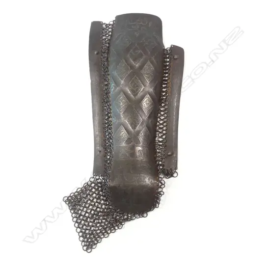 A 15th/17thC Ottoman / Persian Safavid defense for the left leg (greave), for protection of the lower leg of equestrian warriors, of three plates of steel connected by links of solid and riveted chainmail,