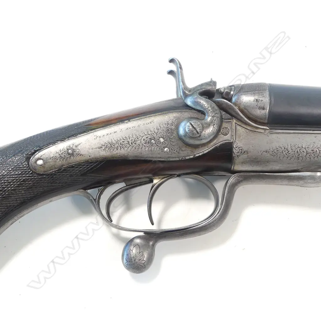 A 19thC under lever double barrel .450 express rifle by Joseph Lang & Son, London, circa 1891. In associated leather case Image 1++