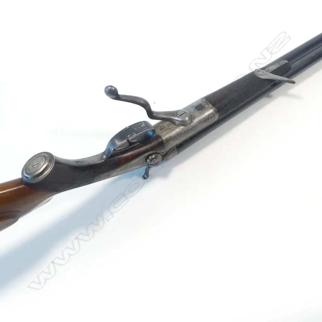 A 19thC under lever double barrel .450 express rifle by Joseph Lang & Son, London, circa 1891. In associated leather case Image 1++