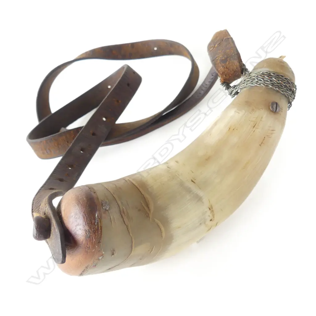 A 19thC ox horn powder flask with leather strap. Image 1++