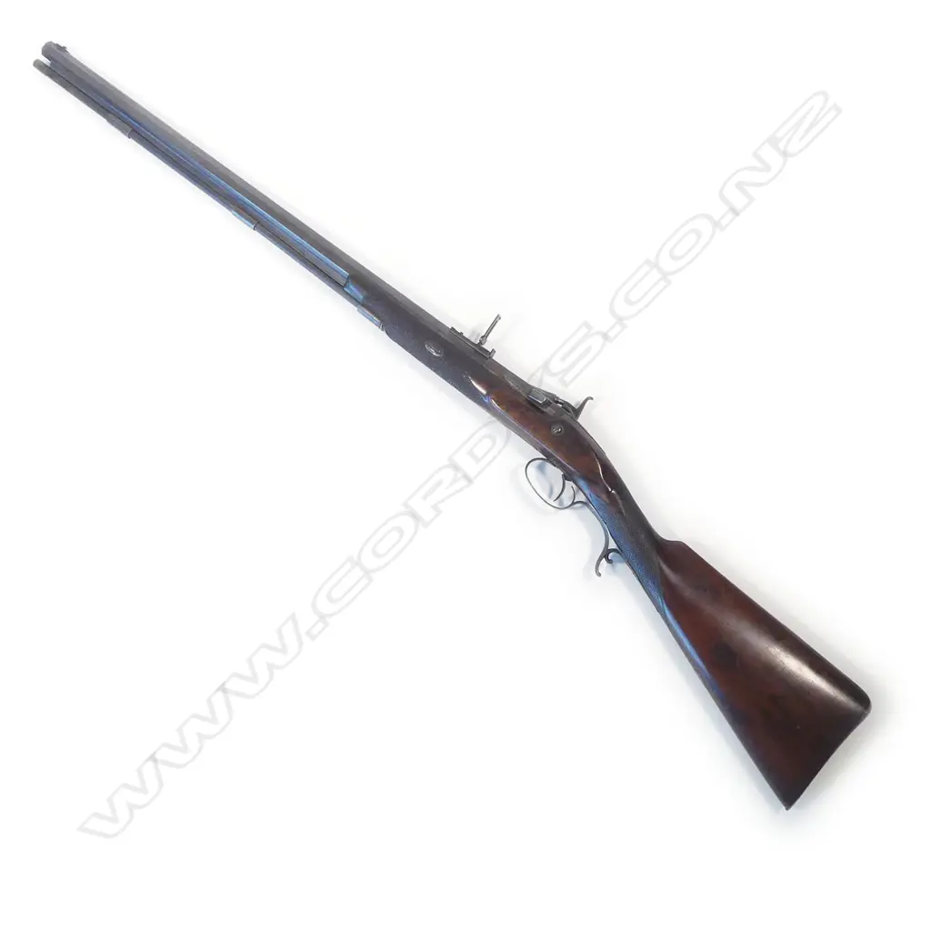 A Snider action .450 cal sporting rifle, with walnut stock, in brass bound oak fitted case Image 1++