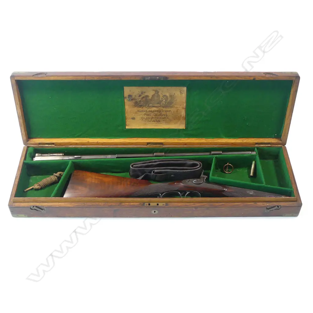 A Snider action .450 cal sporting rifle, with walnut stock, in brass bound oak fitted case Image 1++
