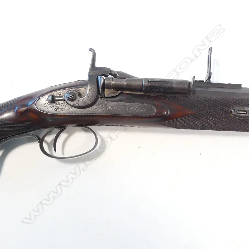 A Snider action .450 cal sporting rifle, with walnut stock, in brass bound oak fitted case Image 1++