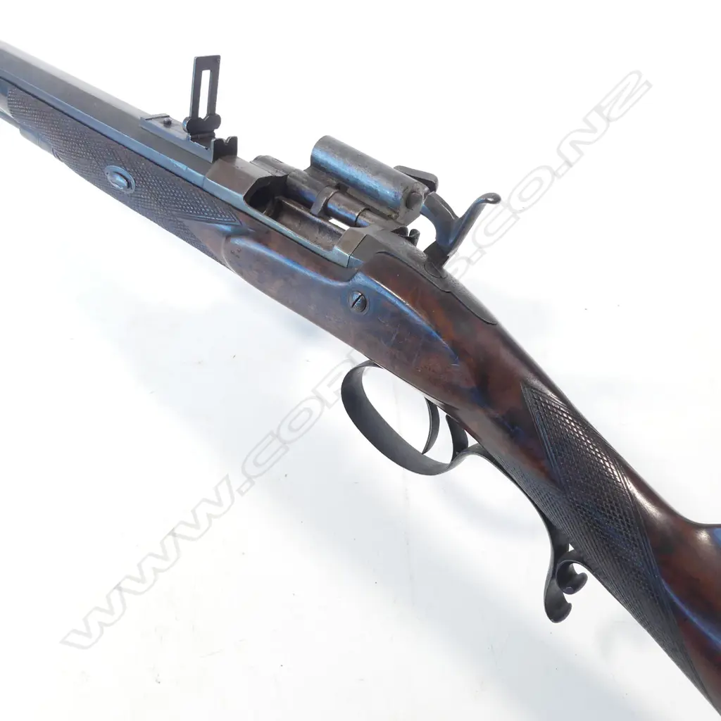 A Snider action .450 cal sporting rifle, with walnut stock, in brass bound oak fitted case Image 1++