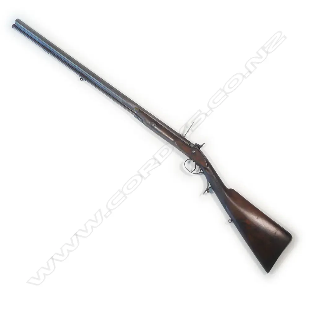 A  mid-19thC .50 cal smoothbore muzzle loading percussion rifle with spare 20 bore shotgun barrel, by Clayton of Lymington. In baize lined fitted oak case with accessories. Image 1++
