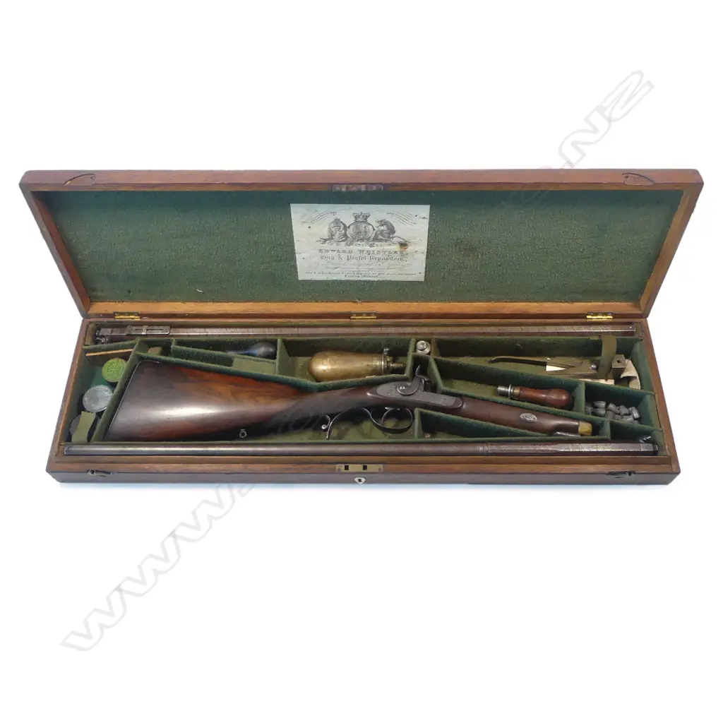 A  mid-19thC .50 cal smoothbore muzzle loading percussion rifle with spare 20 bore shotgun barrel, by Clayton of Lymington. In baize lined fitted oak case with accessories. Image 1++