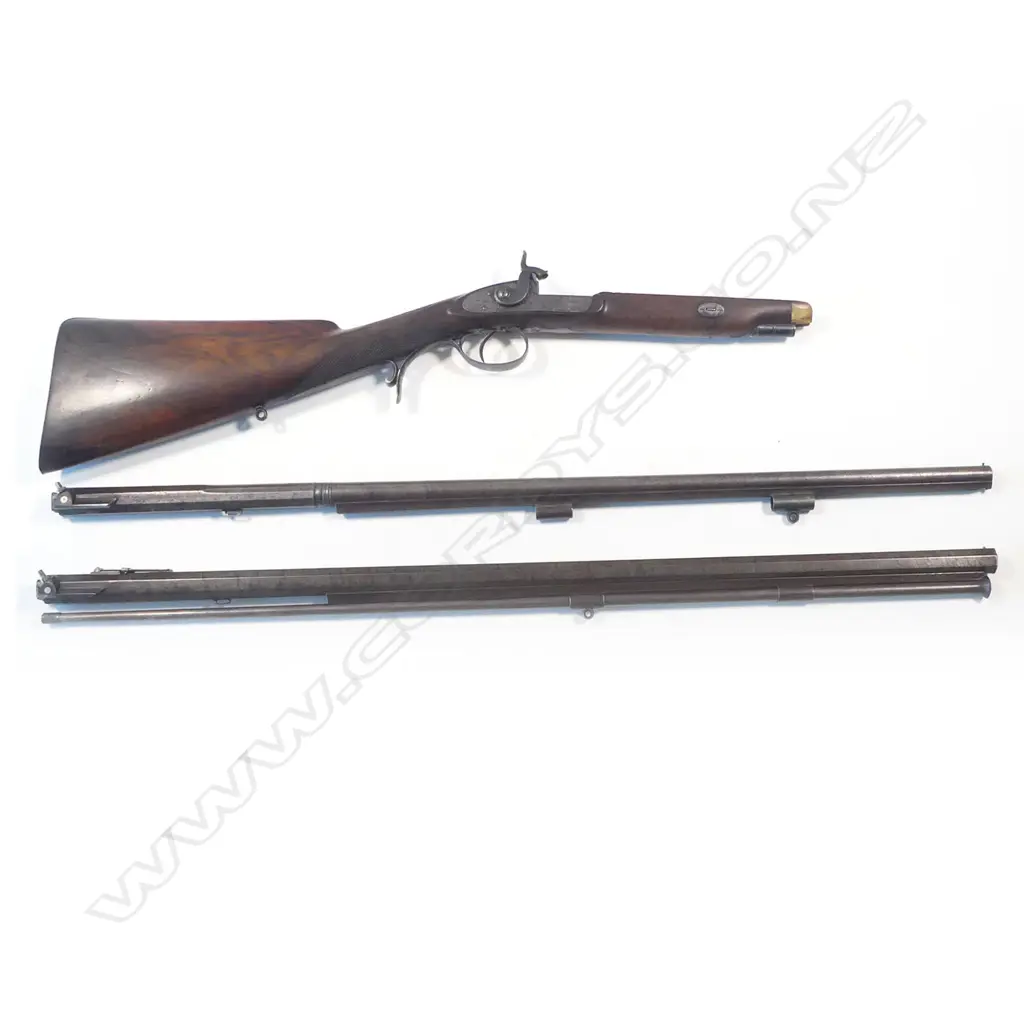 A  mid-19thC .50 cal smoothbore muzzle loading percussion rifle with spare 20 bore shotgun barrel, by Clayton of Lymington. In baize lined fitted oak case with accessories. Image 1++