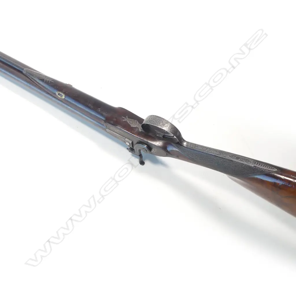 A fine early19thC .18 bore muzzle loading percussion double barrel sporting gun, by John Manton & Son, London, in baize lined fitted mahogany case. Image 1++