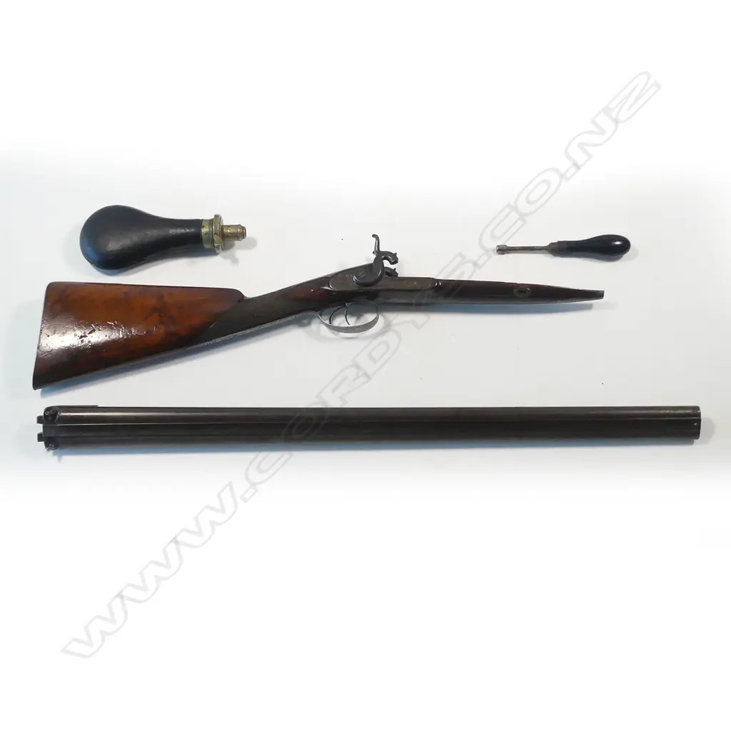 A fine early19thC .18 bore muzzle loading percussion double barrel sporting gun, by John Manton & Son, London, in baize lined fitted mahogany case. Image 1++