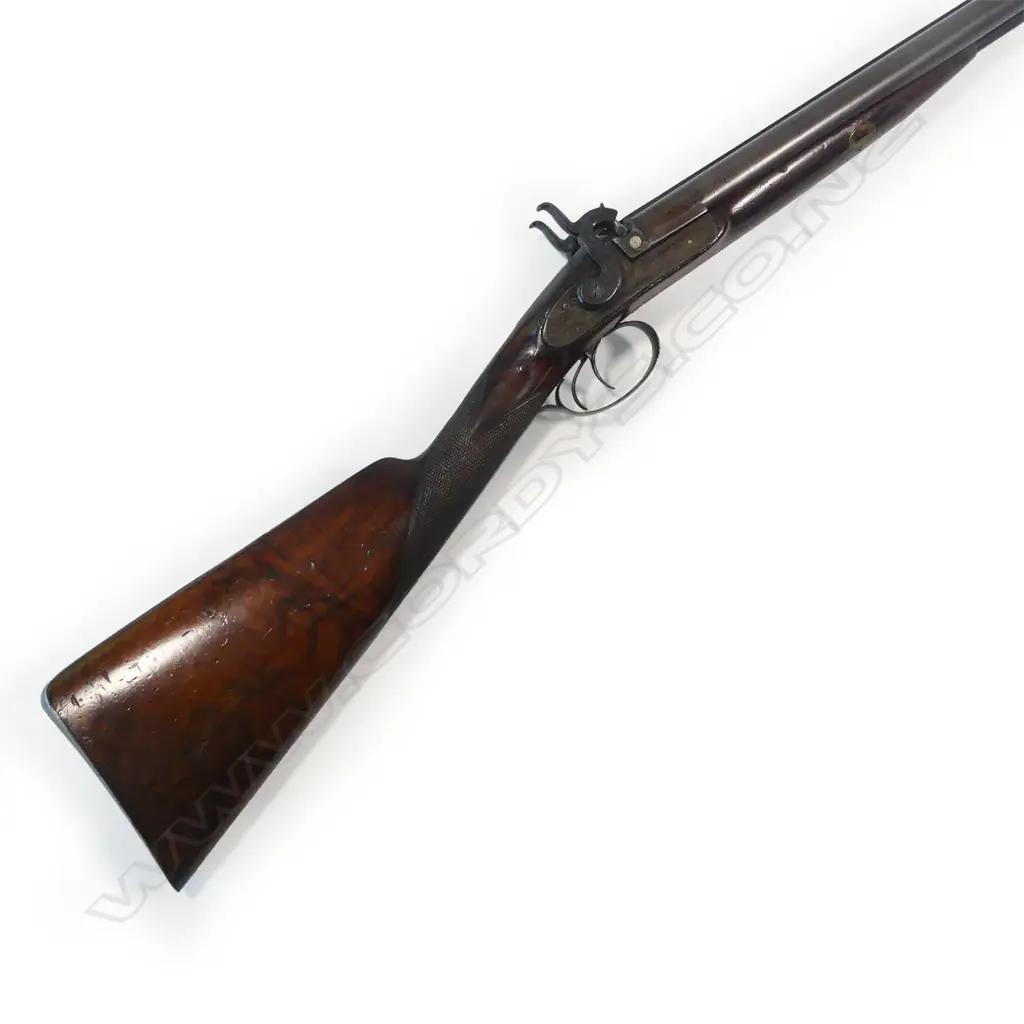 A fine early19thC .18 bore muzzle loading percussion double barrel sporting gun, by John Manton & Son, London, in baize lined fitted mahogany case. Image 1++