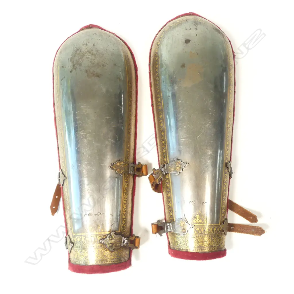 Pair of 18th/19thC Indian dastana / bazu-band armguards, of typical form, with applied gilt borders of palmettes and dense scrolling floral decoration organized in two registers. Image 1++