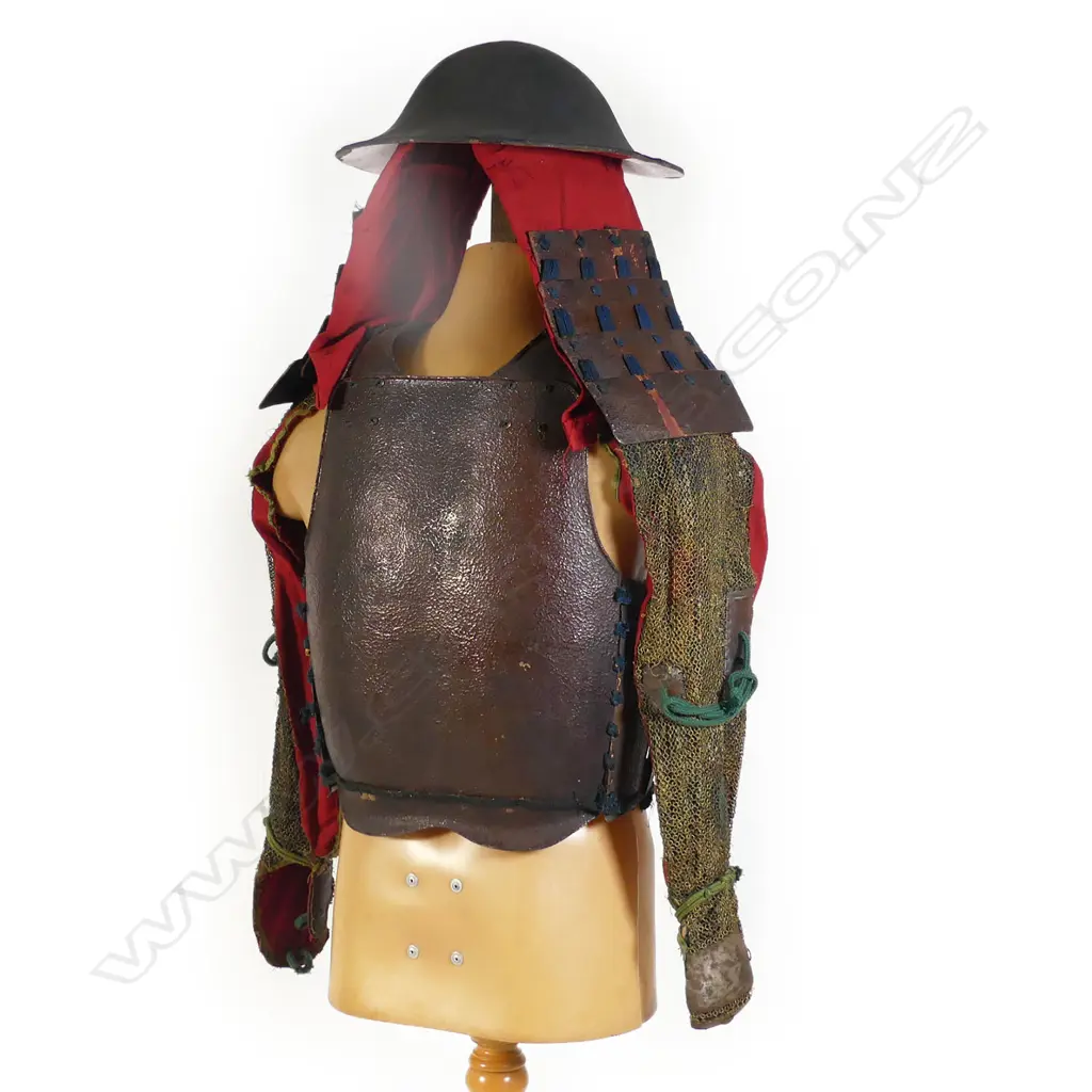 Japanese Samurai armour fittings, 19thC or earlier, includes a lacquered helmet and lacquered metal chest and blackbody plates together with various conforming paneled sections and chain mail with cloth backing, Image 1++