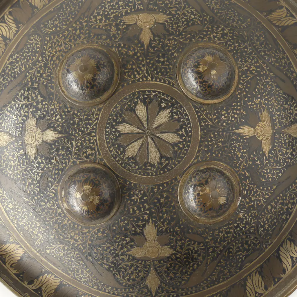 A late 19th/early 20thC Indian fist shield, circular domed shape with four bosses and ogee shaped border, Image 1++
