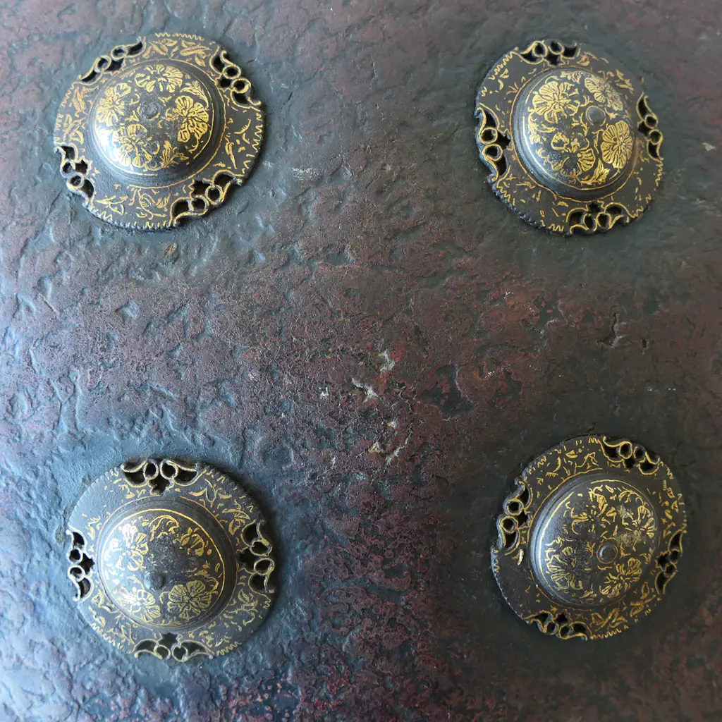 Round Indian Leather shield with four gold Damascened Bosses, Image 1++