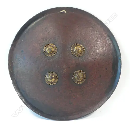 Round Indian Leather shield with four gold Damascened Bosses,