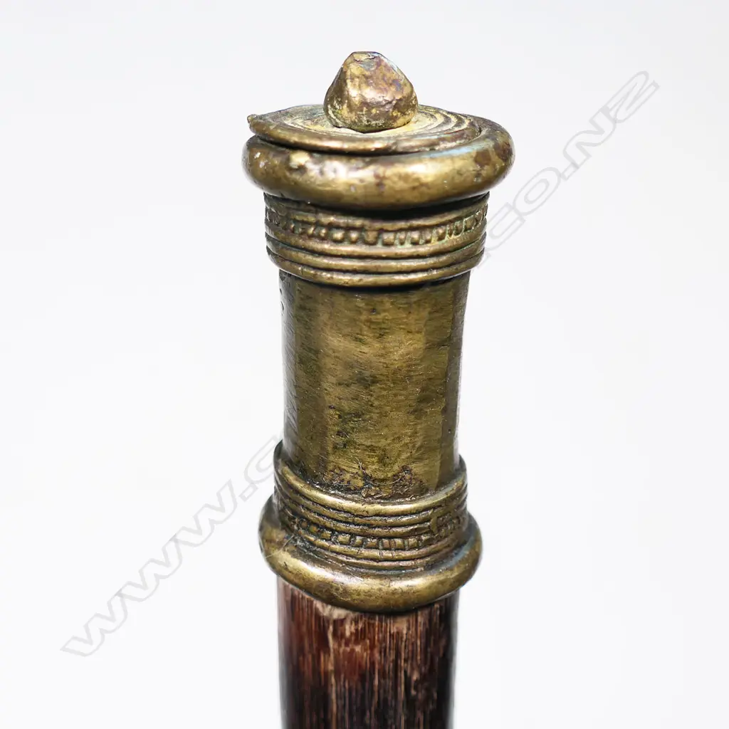 An Indian axe with steel blade, decorated and brass mounted spike, wooden shaft and brass pommel. L.1016mm. Image 1++