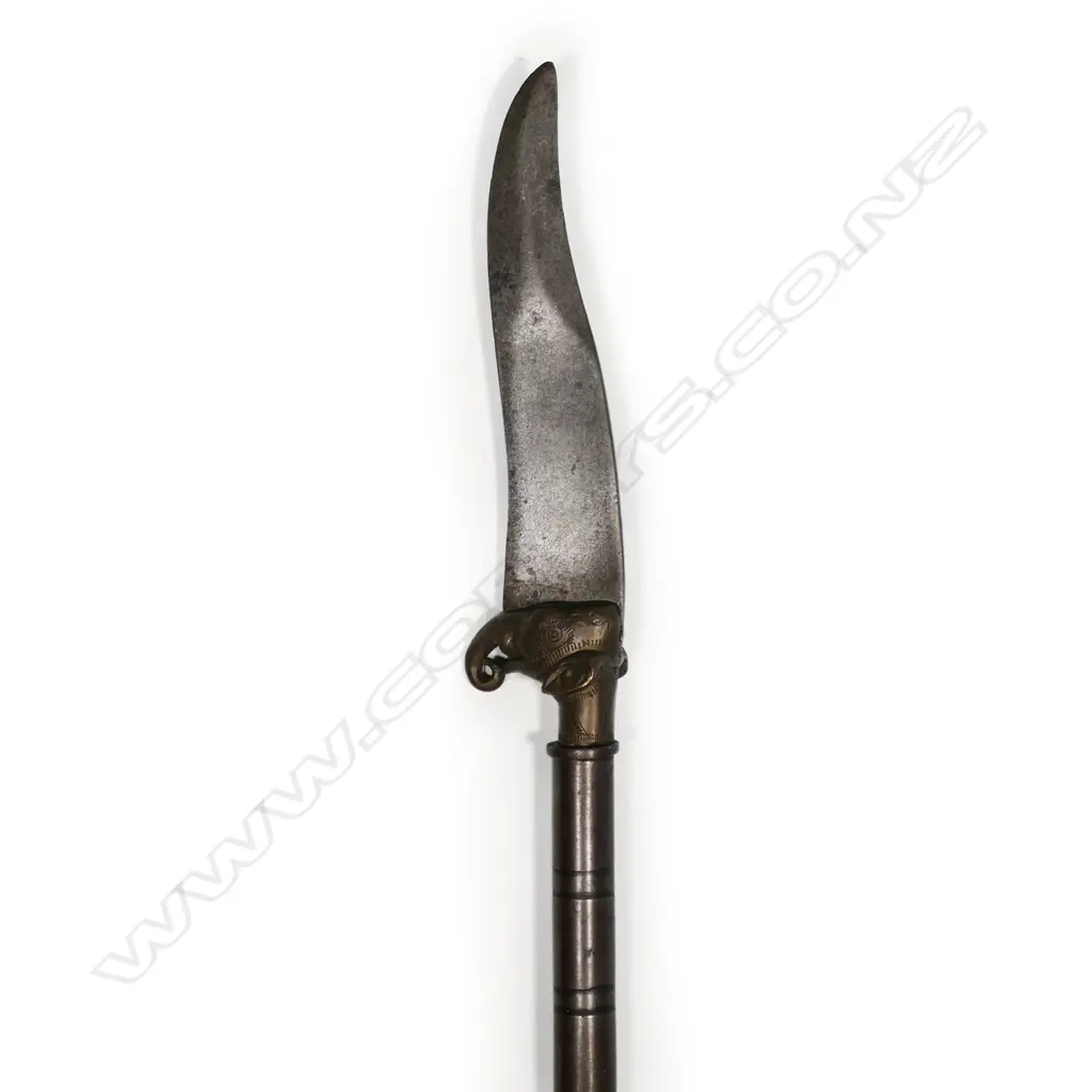An Indian elephant head dagger, with clip pointed steel blade on brass elephant head mount, Image 1++