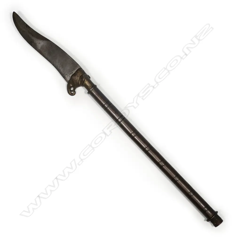 An Indian elephant head dagger, with clip pointed steel blade on brass elephant head mount, Image 1++