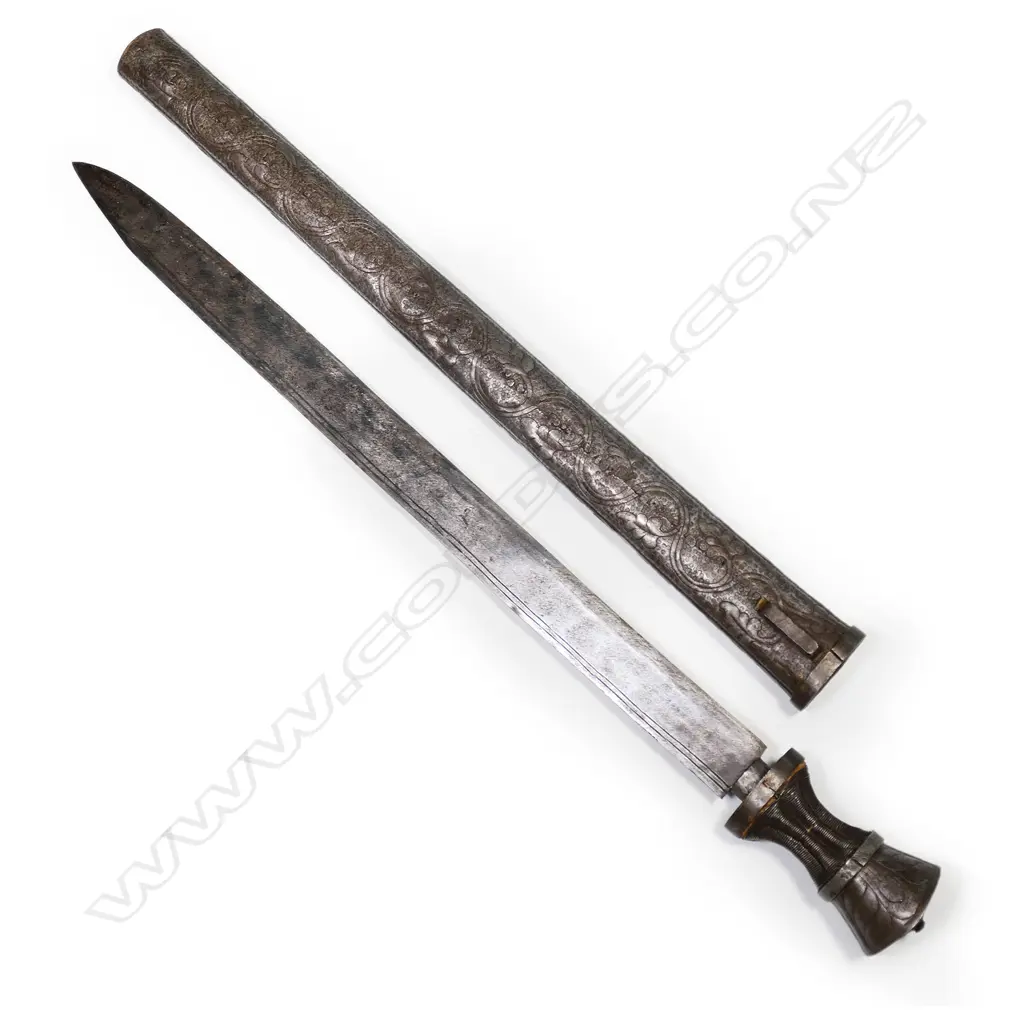 An 18/19thC Tibetan sword with ornately pierced steel scabbard and hilt, Image 1++