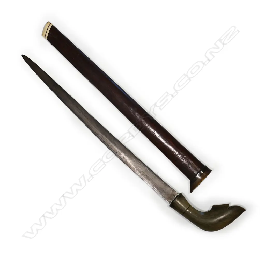 An Indonesian short sword with watered blade, Image 1++