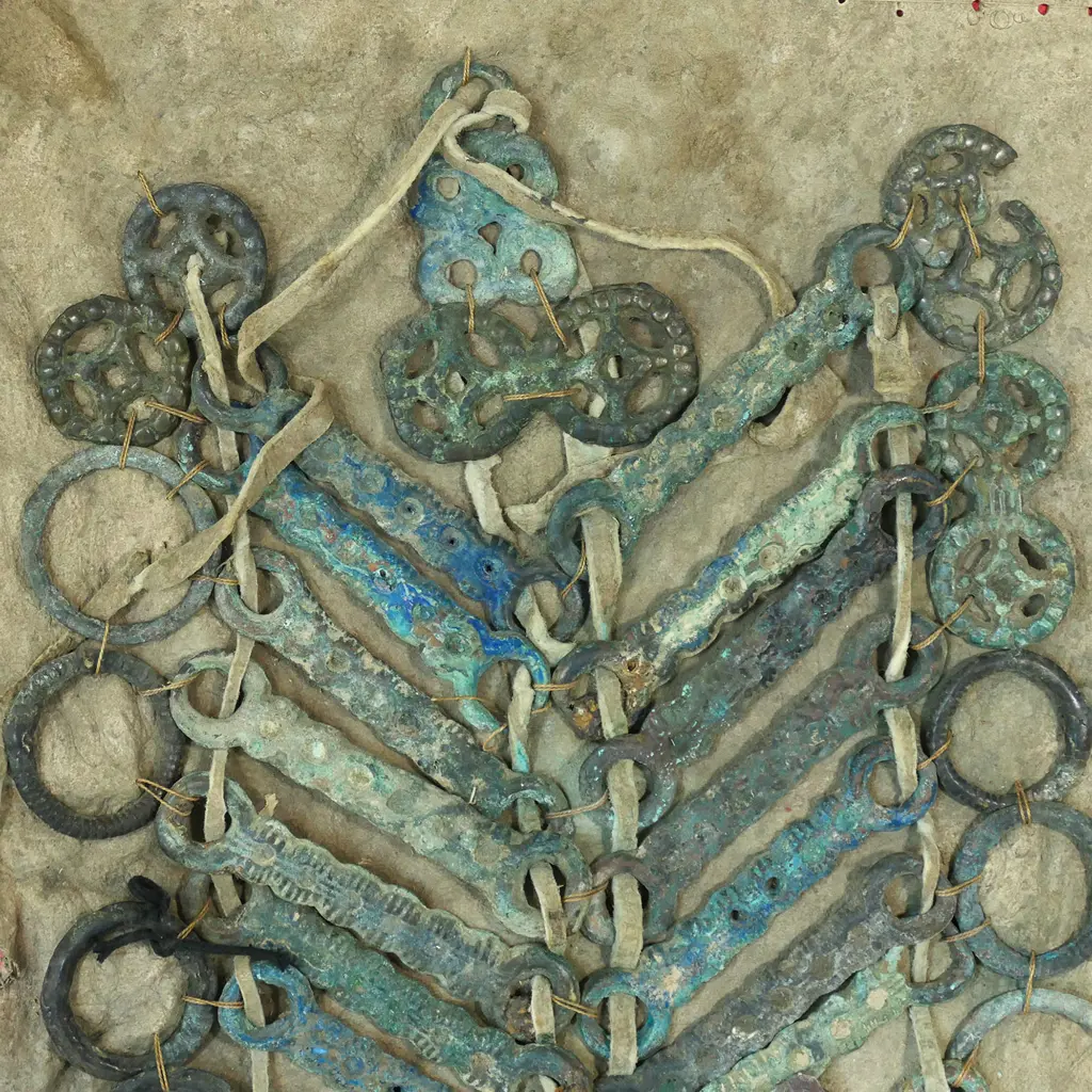 Archaic style, verdigris patinated bronze rings and bars reputedly Sung Dynasty (AD960-1126) horse armour, thong strung and mounted on a leather panel. Image 1++