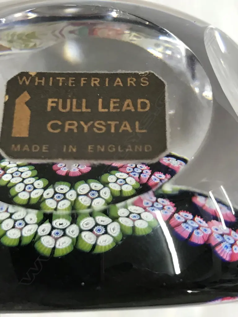A Whitefriars paperweight decorated to the interior with coloured canes Image 1++