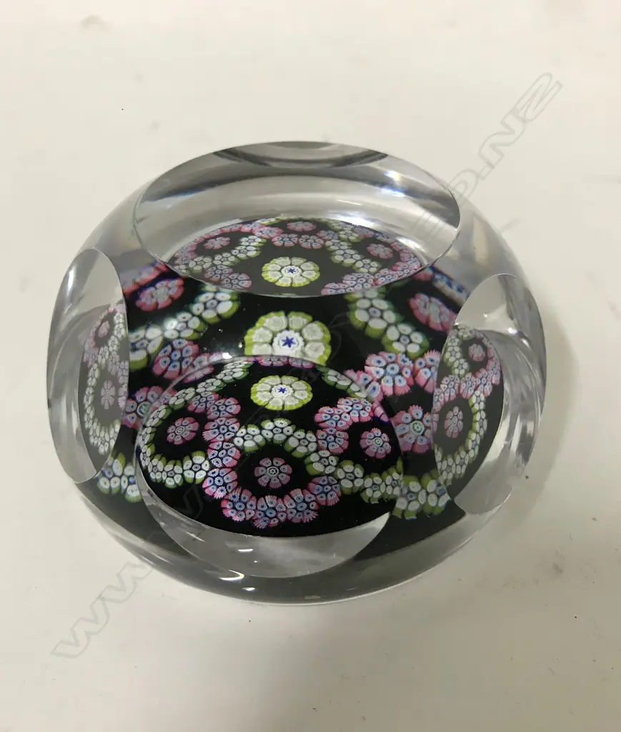 A Whitefriars paperweight decorated to the interior with coloured canes Image 1++