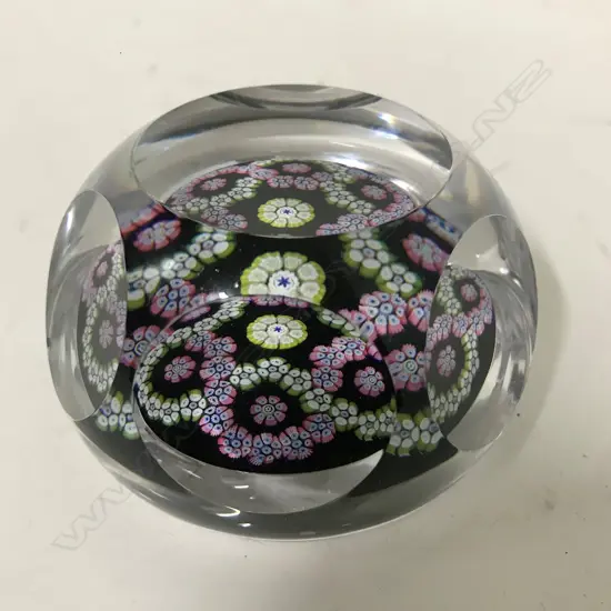 A Whitefriars paperweight decorated to the interior with coloured canes