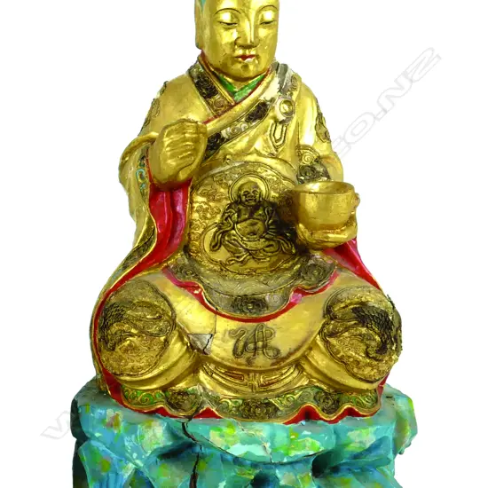 A Chinese carved and gilded wooden Buddhist figure