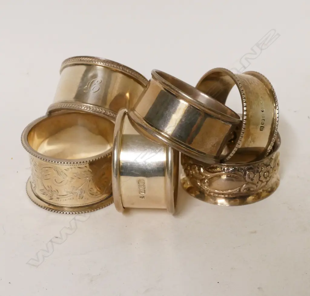Six various silver napkin rings Image 1++