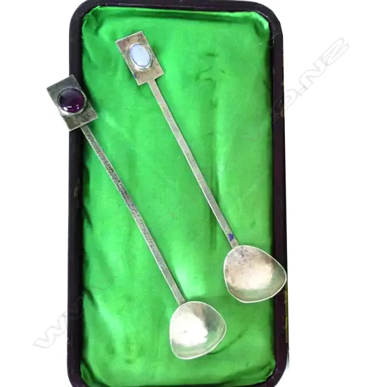 A pair of Arts & Crafts silver and gem set sauce ladles