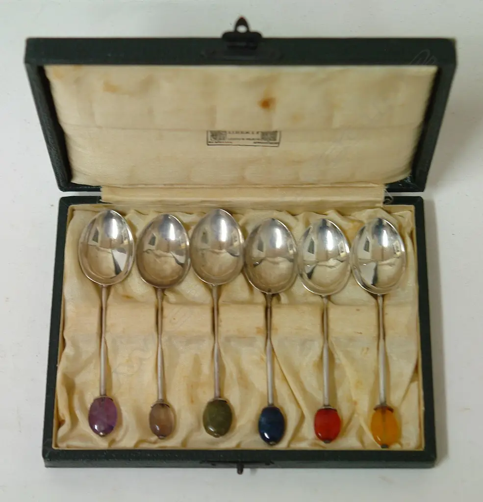 A set of six cased Liberty & Co. silver and gemstone finial coffee spoons Image 1++