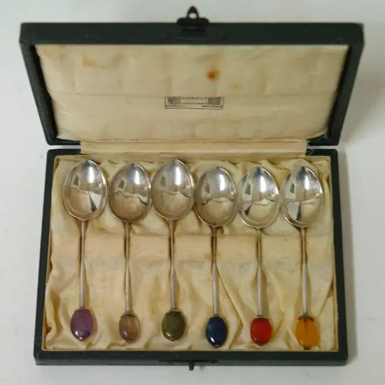 A set of six cased Liberty & Co. silver and gemstone finial coffee spoons
