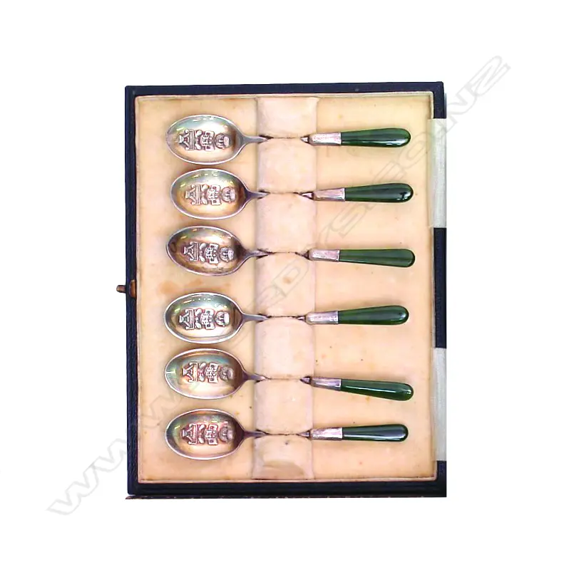 A set of silver teaspoons decorated with Maori motifs and greenstone handles Image 1++
