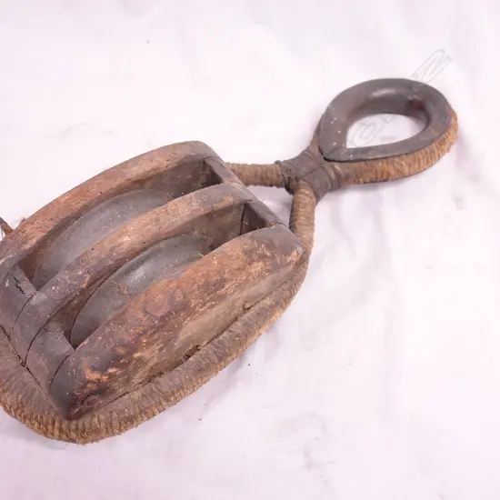 A vintage ship's wood framed double pulley