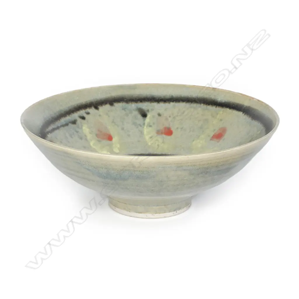 Doreen Blumhardt (1914-2009) flared pedestal bowl. The interior with red dots highlighted with yellow and with dark bands. Impressed potters mark. Dia.248mm. Image 1++