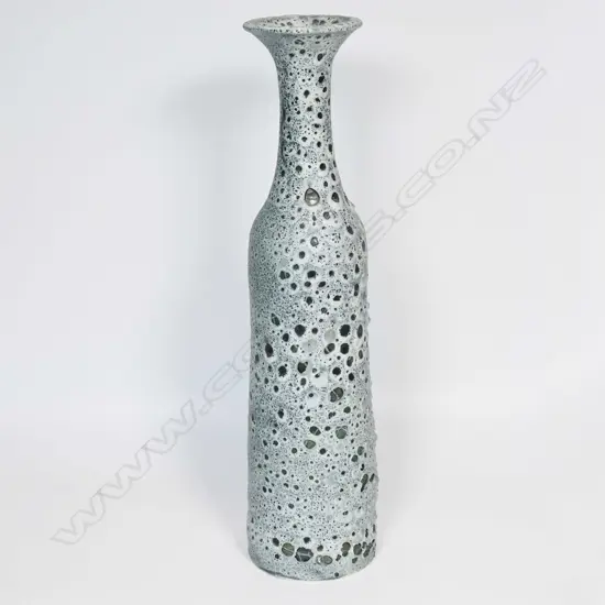 Graham Ambrose bubble glaze long bottle vase; the pale grey glaze on dark ground, long tapered cylindrical body. Impressed potters mark to base. H.485mm. Note: This unique high fired bubble glaze is one of four pieces made late 1990's early 2000's.