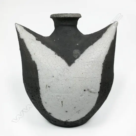 A raku fired winged vase,