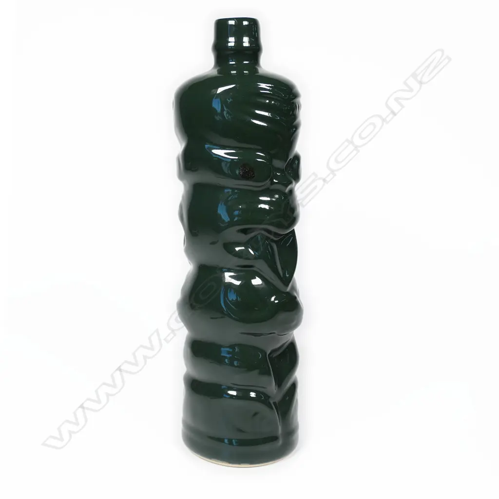 A Green Hei-Tiki liqueur bottle, Image 1++