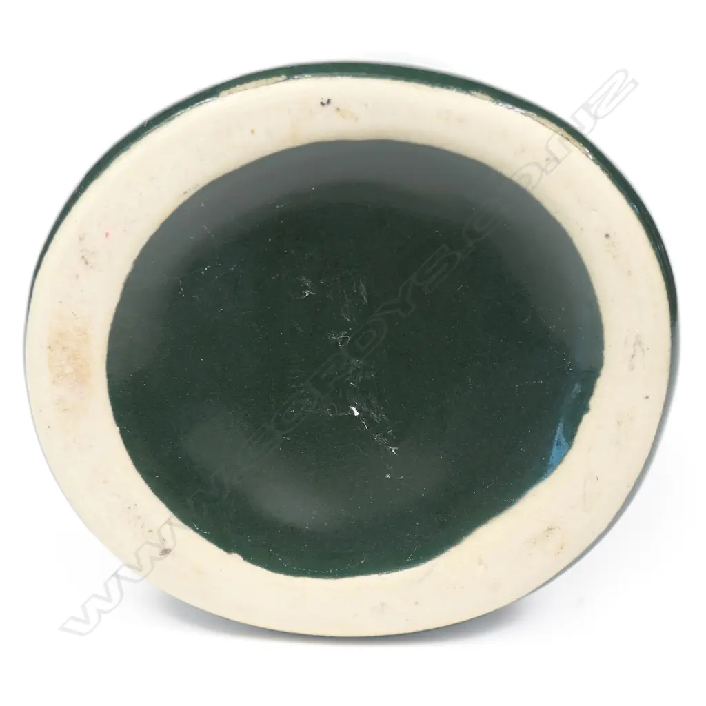 A Green Hei-Tiki liqueur bottle, Image 1++