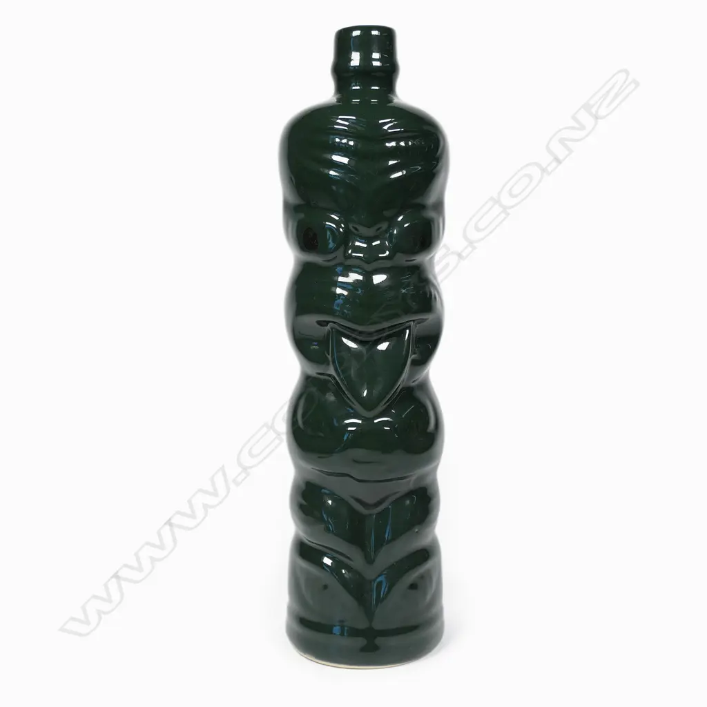 A Green Hei-Tiki liqueur bottle, Image 1++