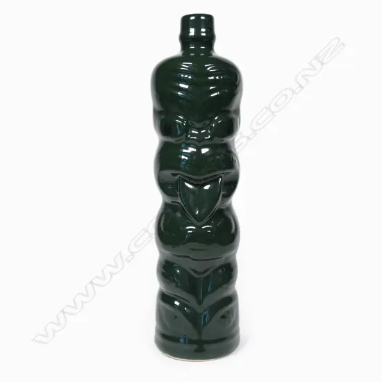 A Green Hei-Tiki liqueur bottle,