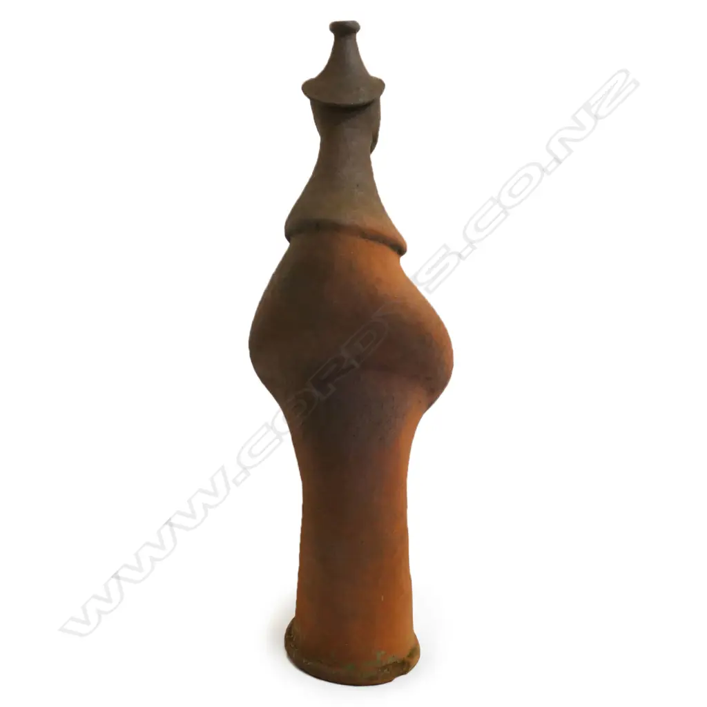 Barry Brickell (1935-2016) wood fired terracotta sculpture. A hand built anthropomorphic form morphing into a hatted bust, lower section of the stylised leg form with curved base. Unglazed with natural kiln firing variation. Chip and surface loss to foot edge. H.1250mm, Image 1++