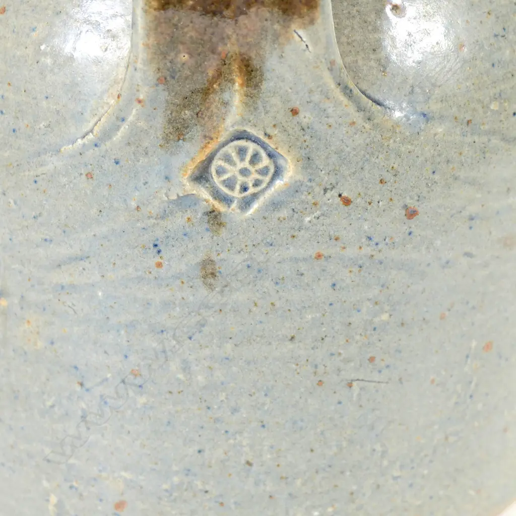 Barry Brickell (1935-2016) flagon; ash grey glazed bell form with tenmoko glazed strap handle and spout. Maker's mark to handle's base. H.200mm Dia.150mm Image 1++