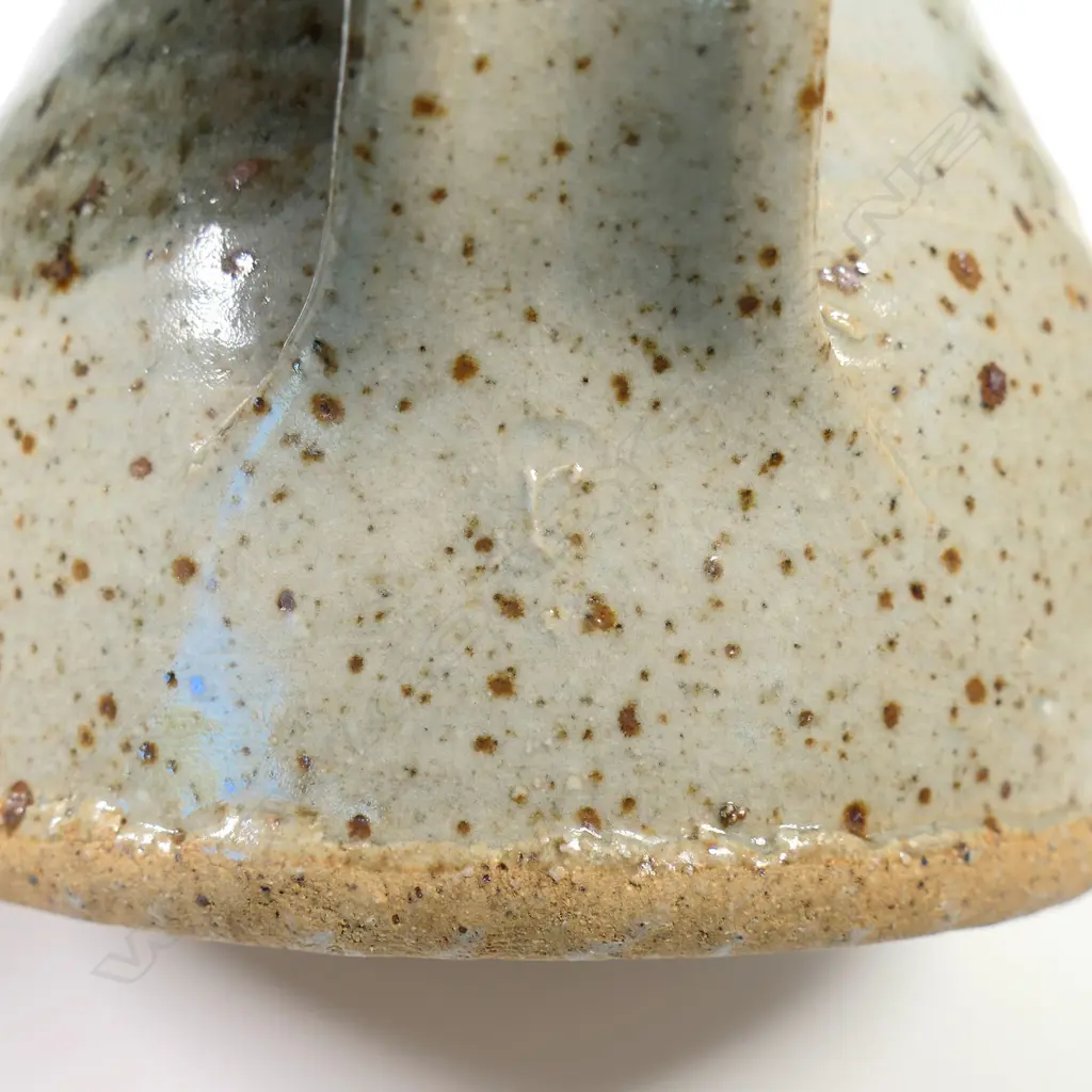 Mug and jug in the style of Barry Brickell. A tenmoko glazed mug with potter's mark (has small glaze loss) H.115. Jug has small 'r' impressed under handle, 125mm Image 1++