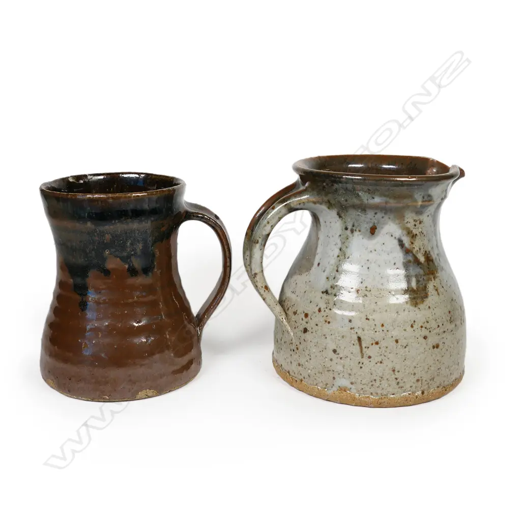 Mug and jug in the style of Barry Brickell. A tenmoko glazed mug with potter's mark (has small glaze loss) H.115. Jug has small 'r' impressed under handle, 125mm Image 1++