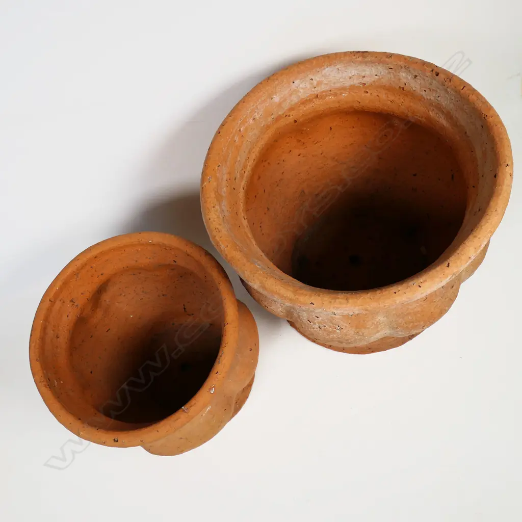 Barry Brickell (1935-2016) two unglazed terracotta planters with lobed and fluted walls. Potter's mark to foot. H.140 & 180mm. Image 1++